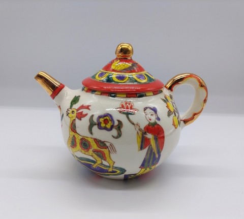 Tea set, in overglaze enamels with peach and flower motifs
