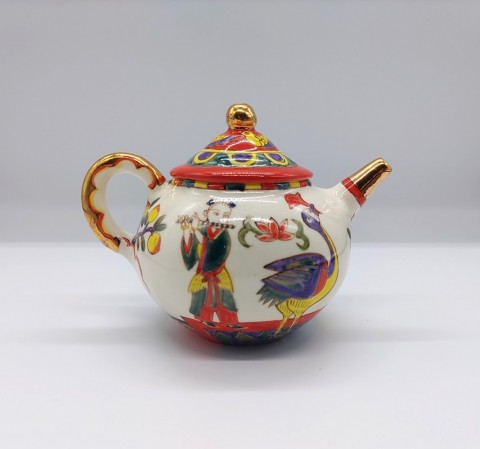 Tea set, in overglaze enamels with peach and flower motifs